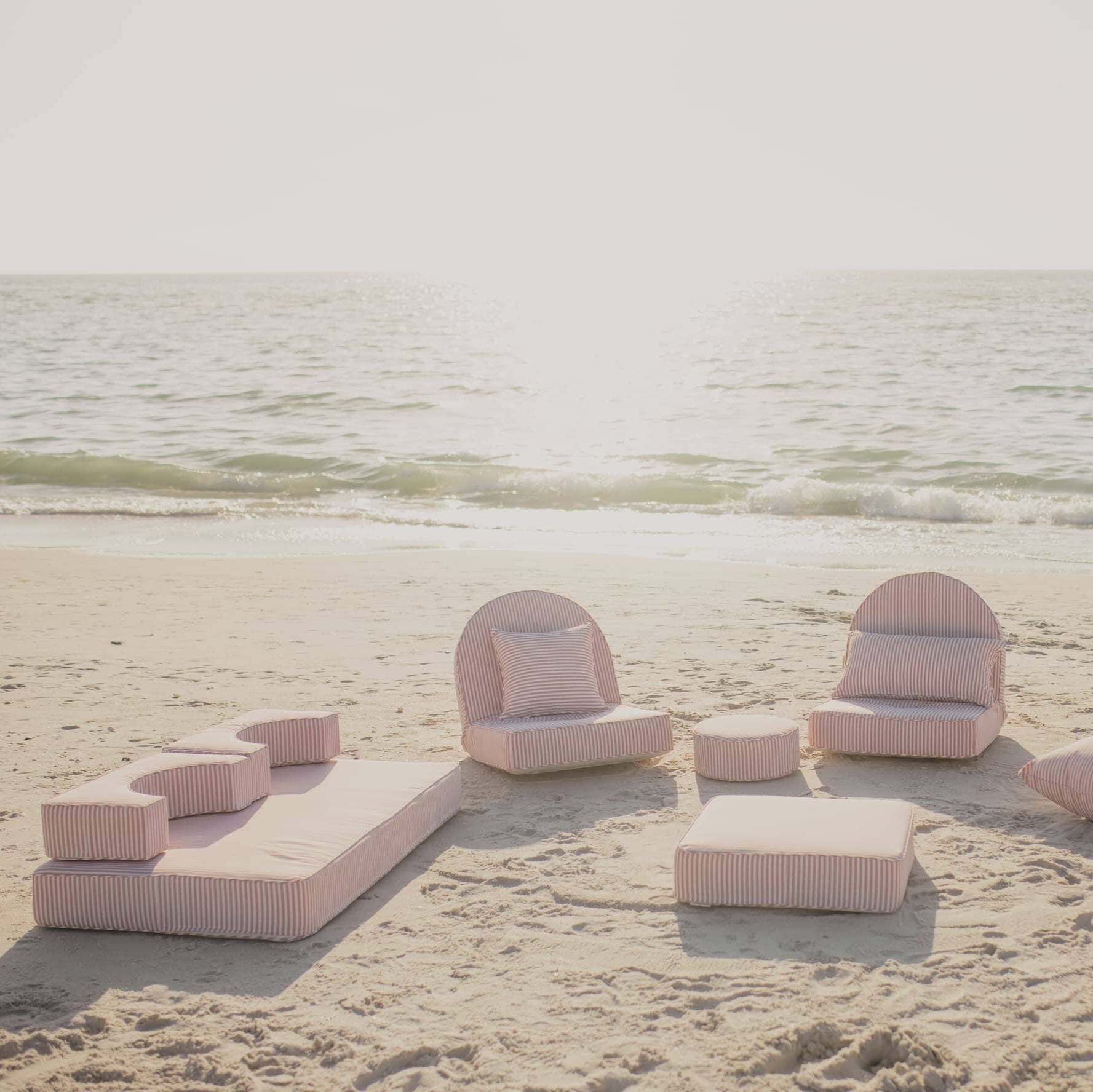 beach picnic with pink stripe modular pillow stack