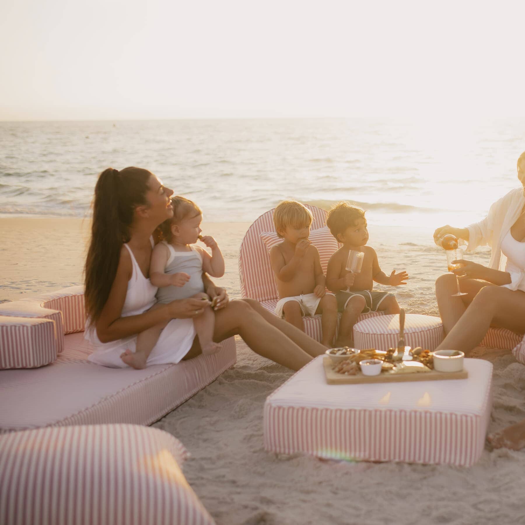 beach picnic with pink stripe modular pillow stack