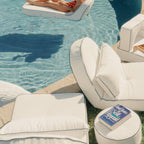 white modular cushions next to a pool