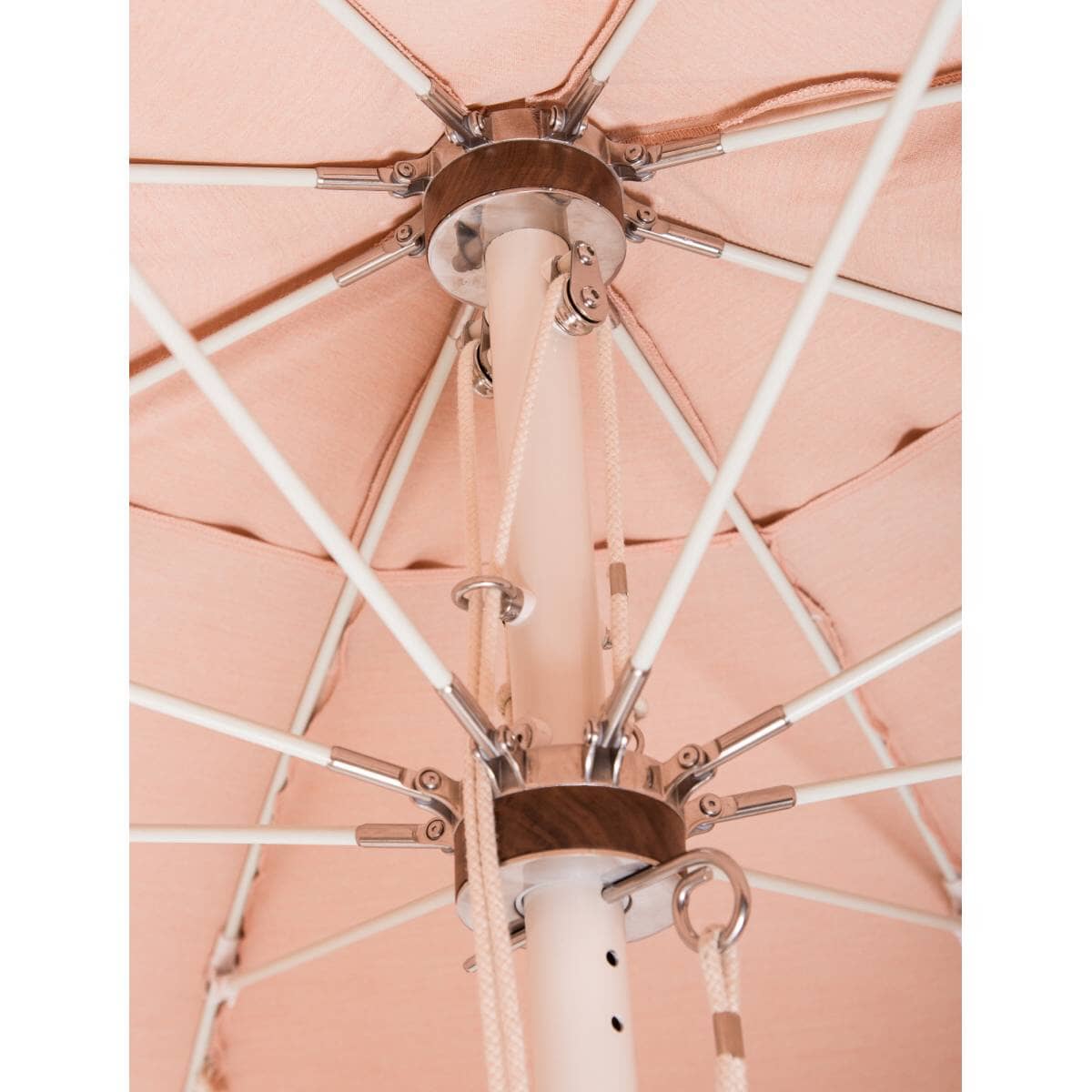 close up hardware detail of rivie pink patio umbrella