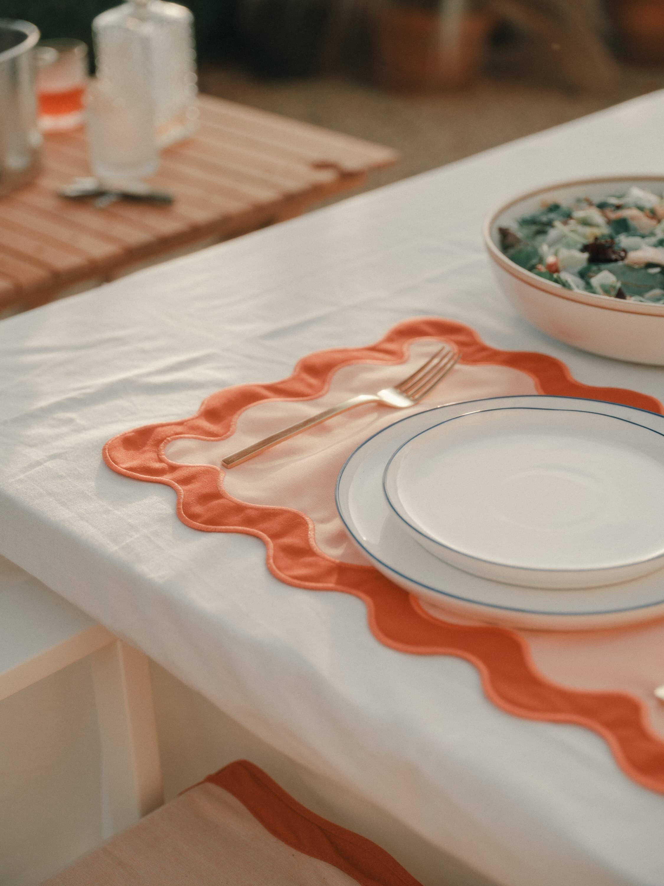 table setting with table cloth and placemat