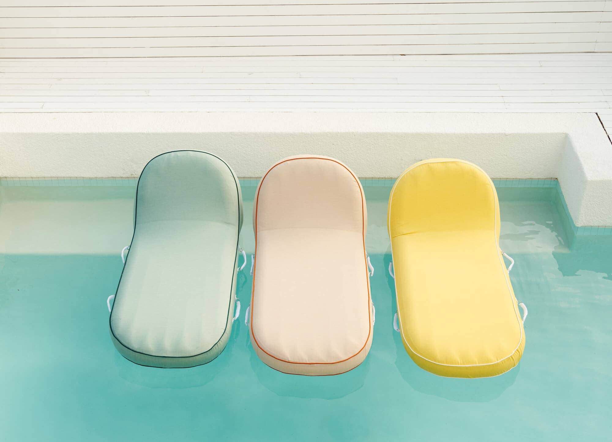 Riviera pool loungers in a pool