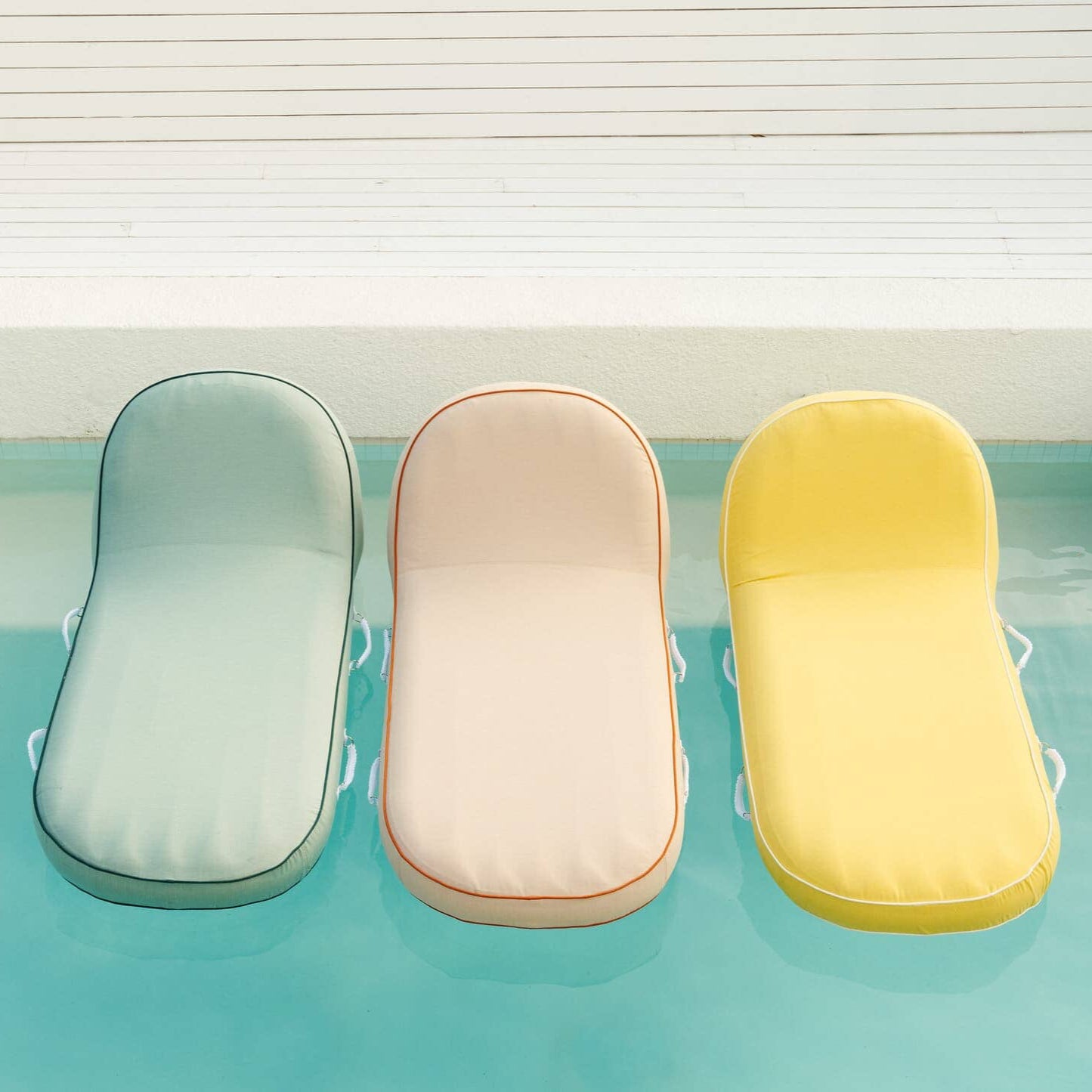 Pool loungers in the pool