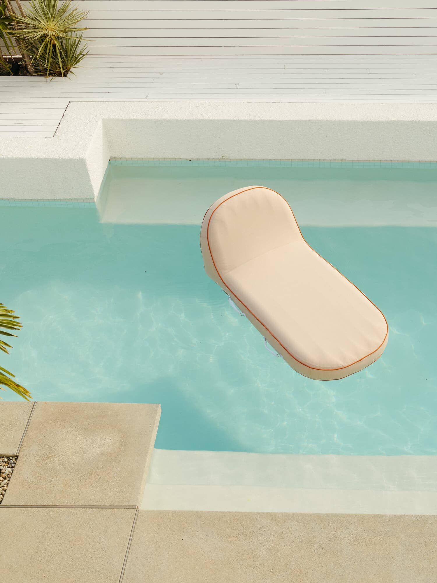 Riviera pink pool lounger in the pool
