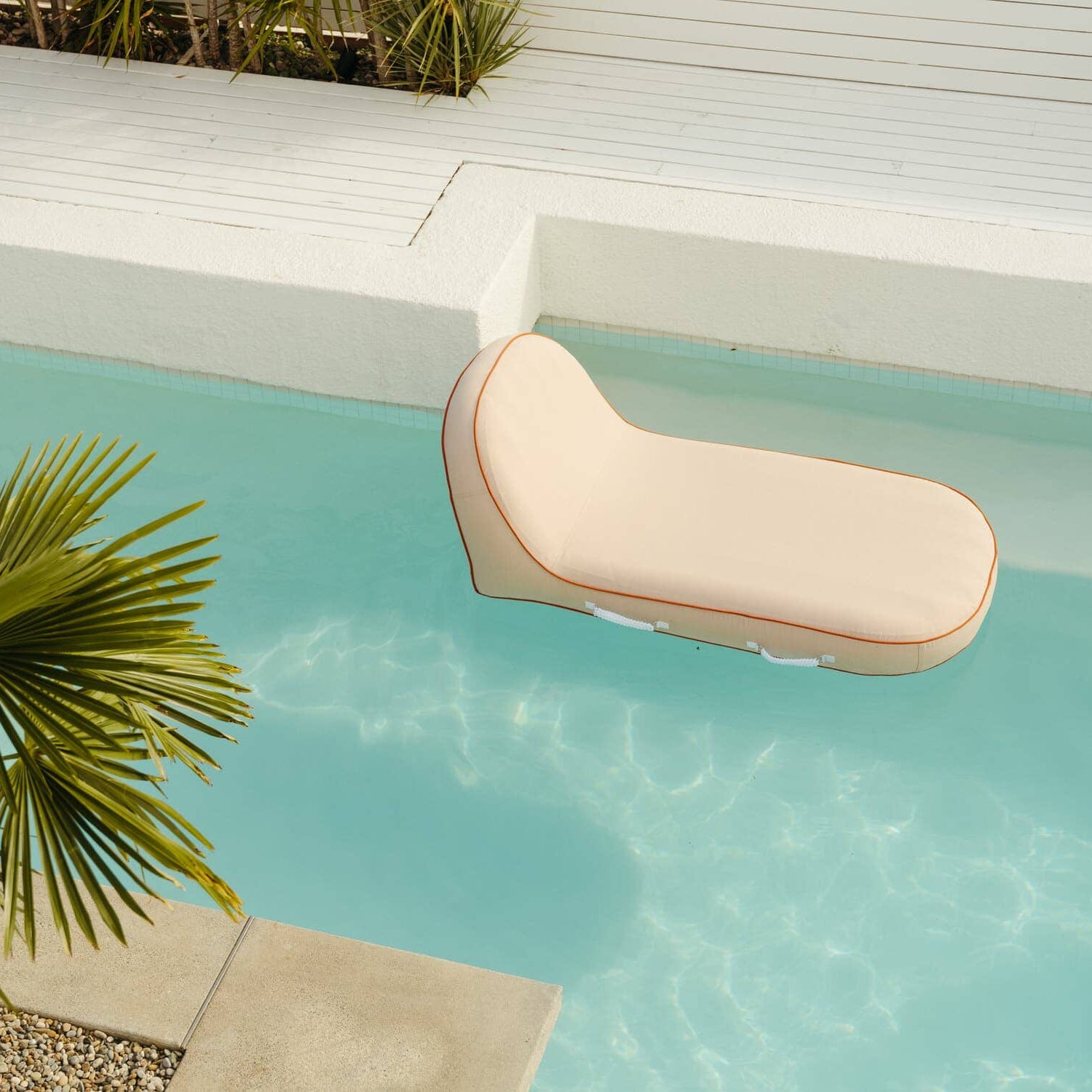 Riviera pink pool lounger in the pool