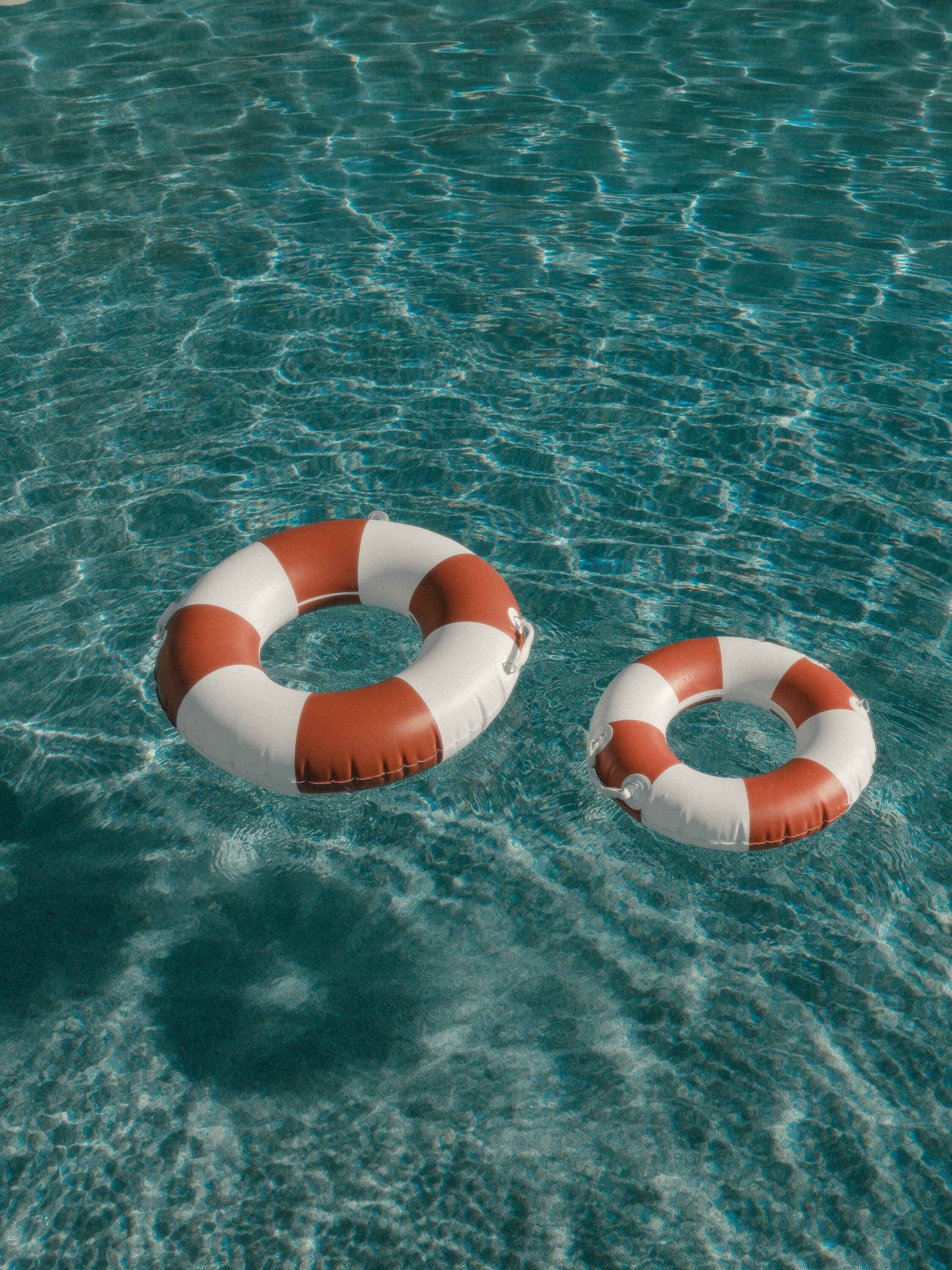 pool rings floating in a pool