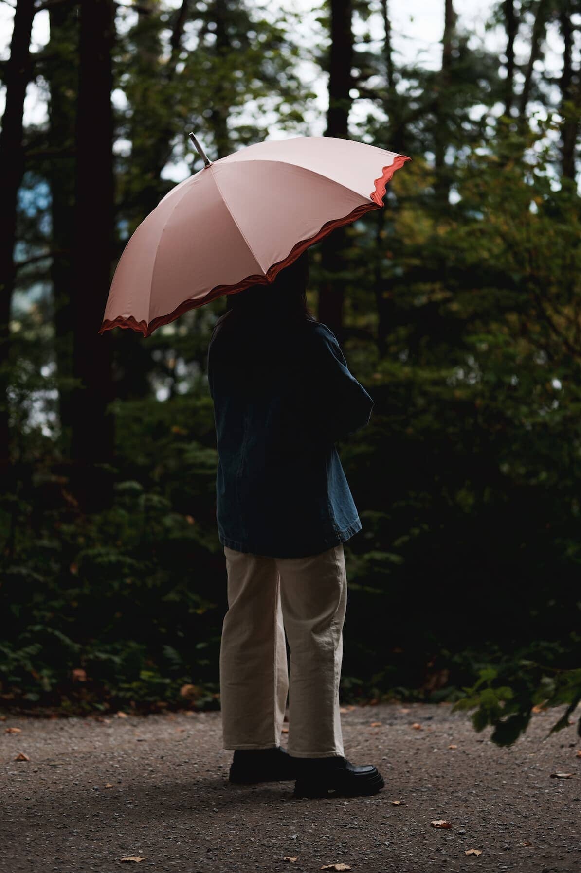 Rivie pink rain umbrella in the woods