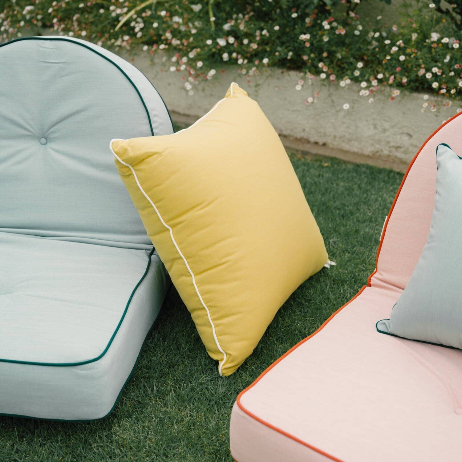 Reclining pillow loungers in a garden setting