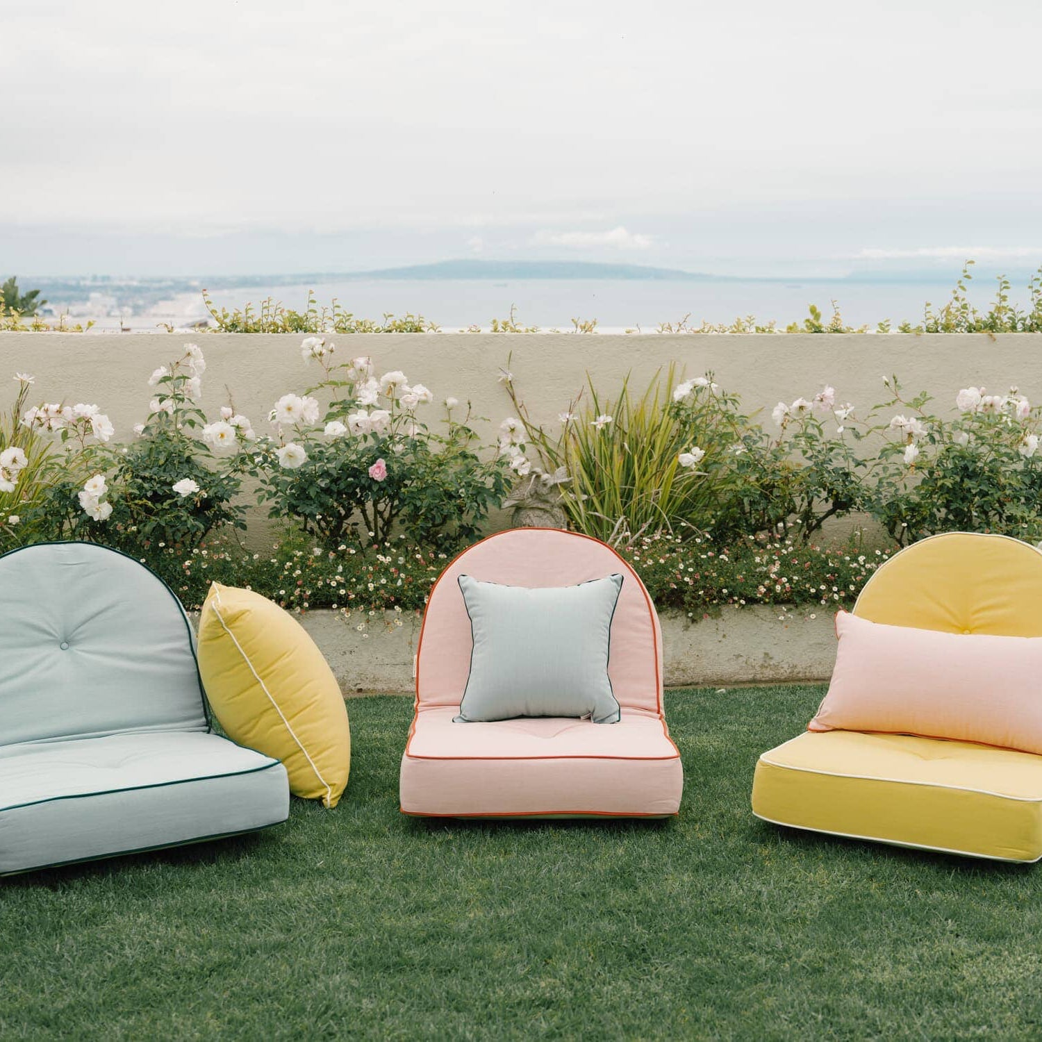 Reclining pillow loungers in a garden setting