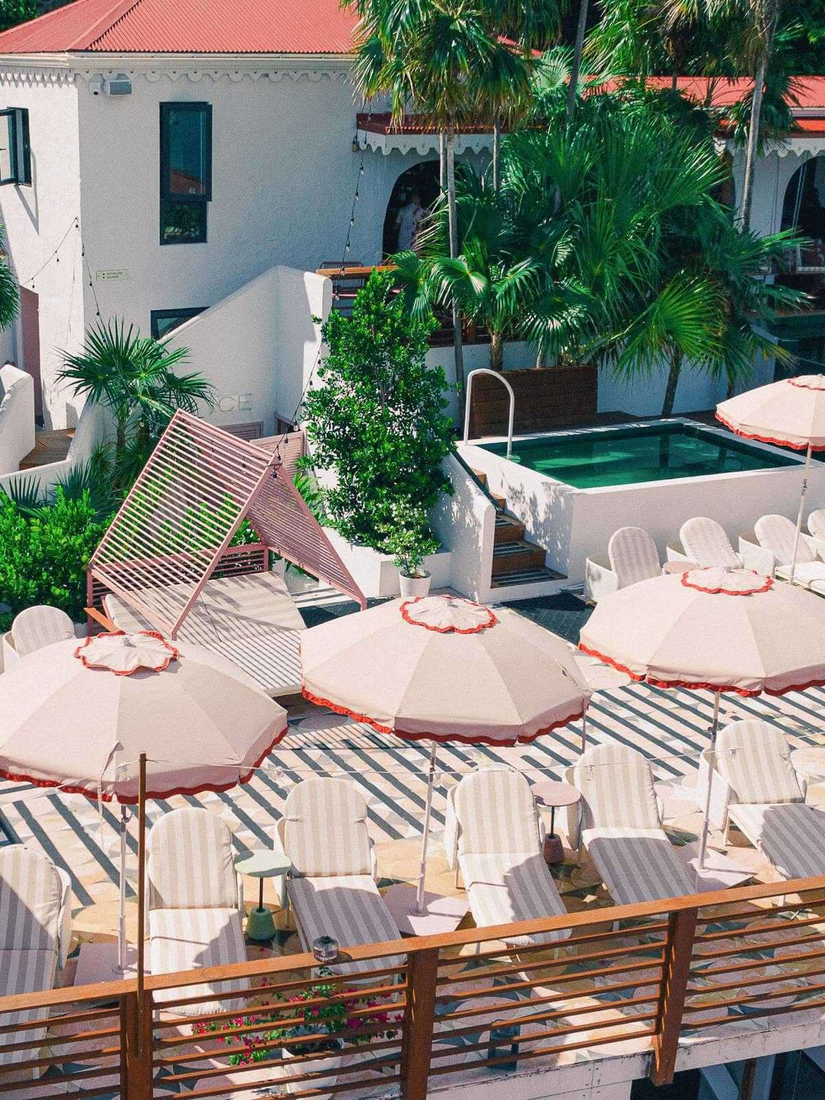 Beach club umbrellas in a coastal beach club setting