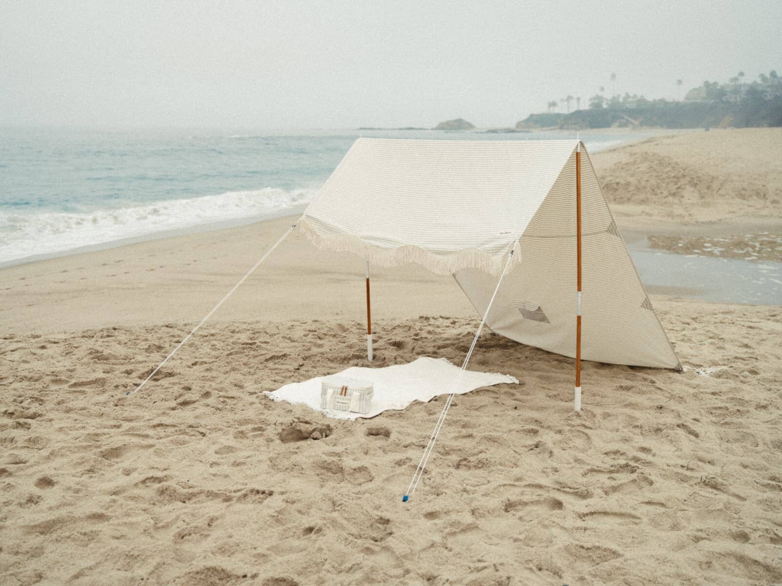 Sage tent and cooler on the beach