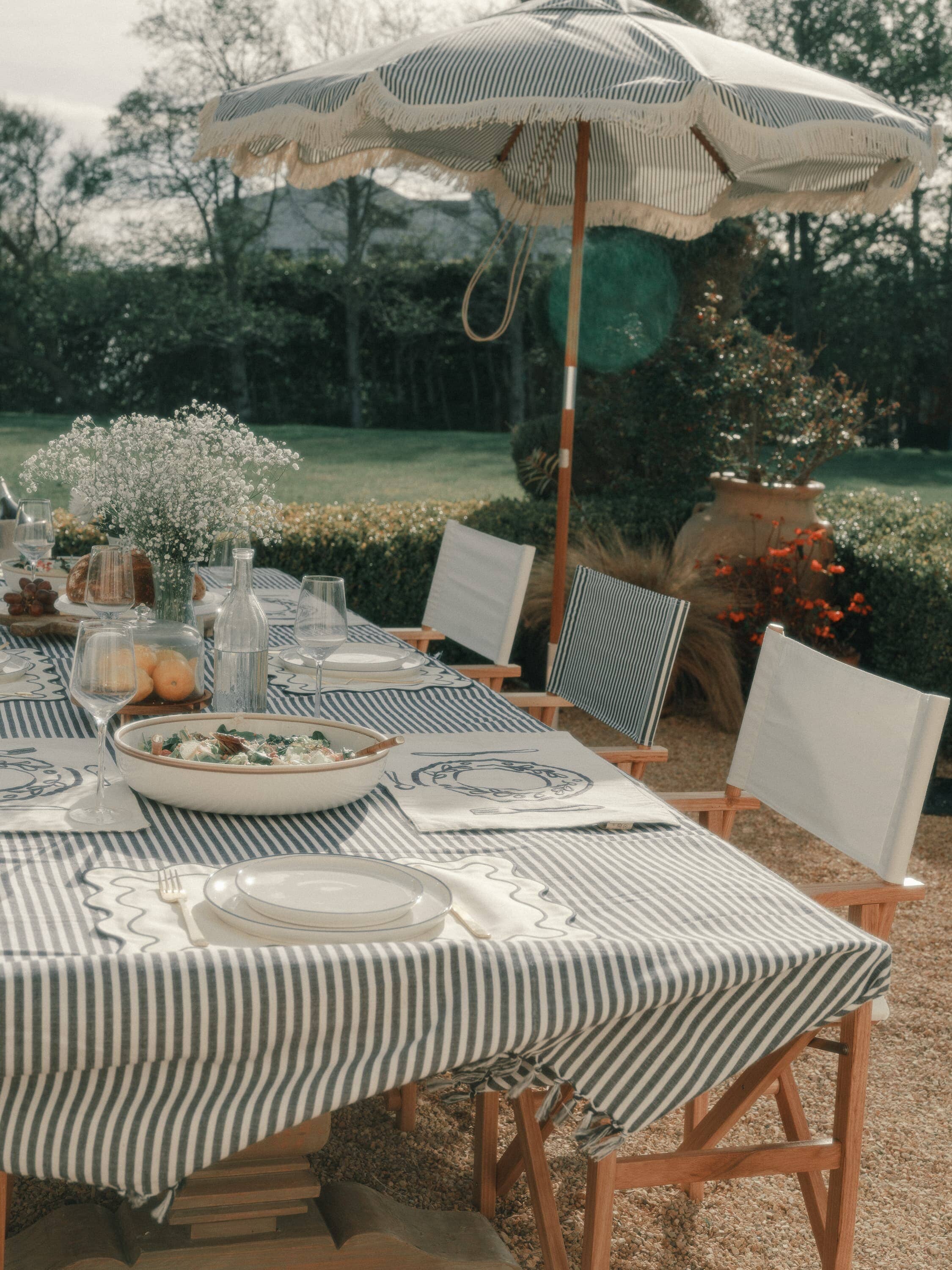 outdoor table setting with navy tablecloth