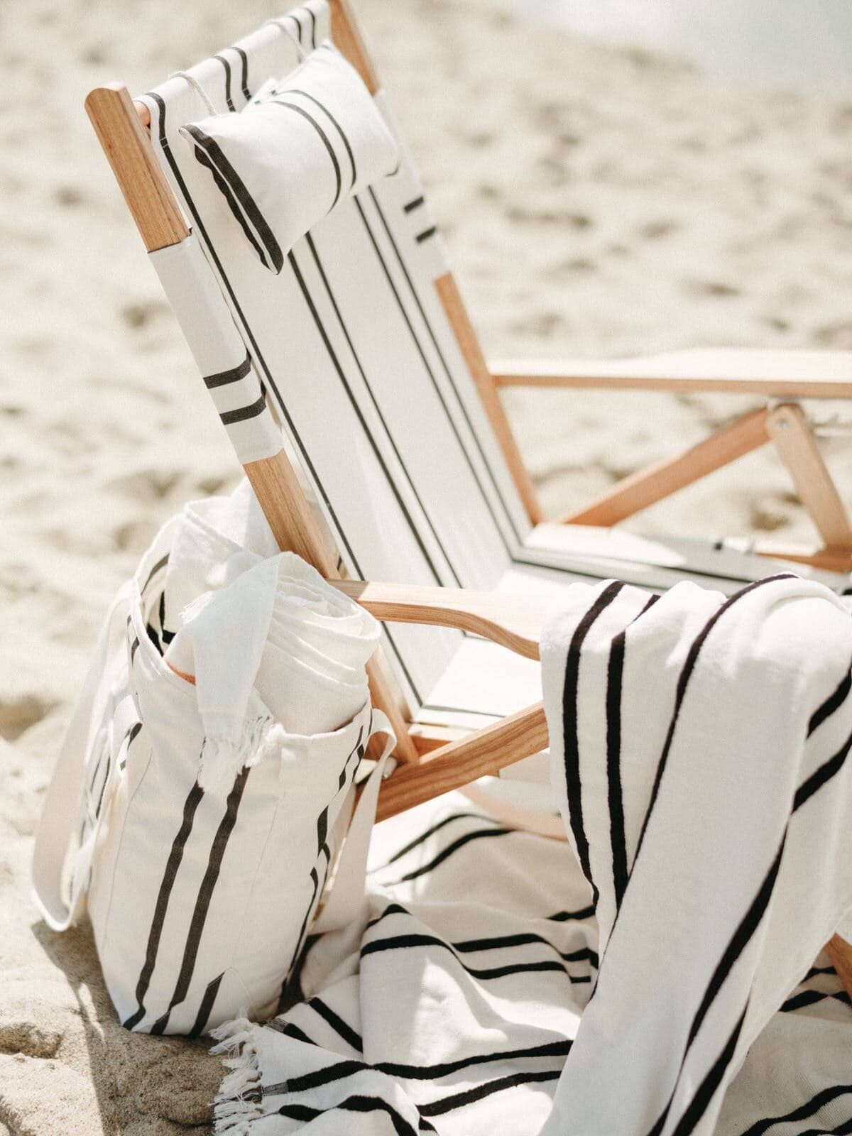 Two stripe tommy chair on the beach with matching accessories