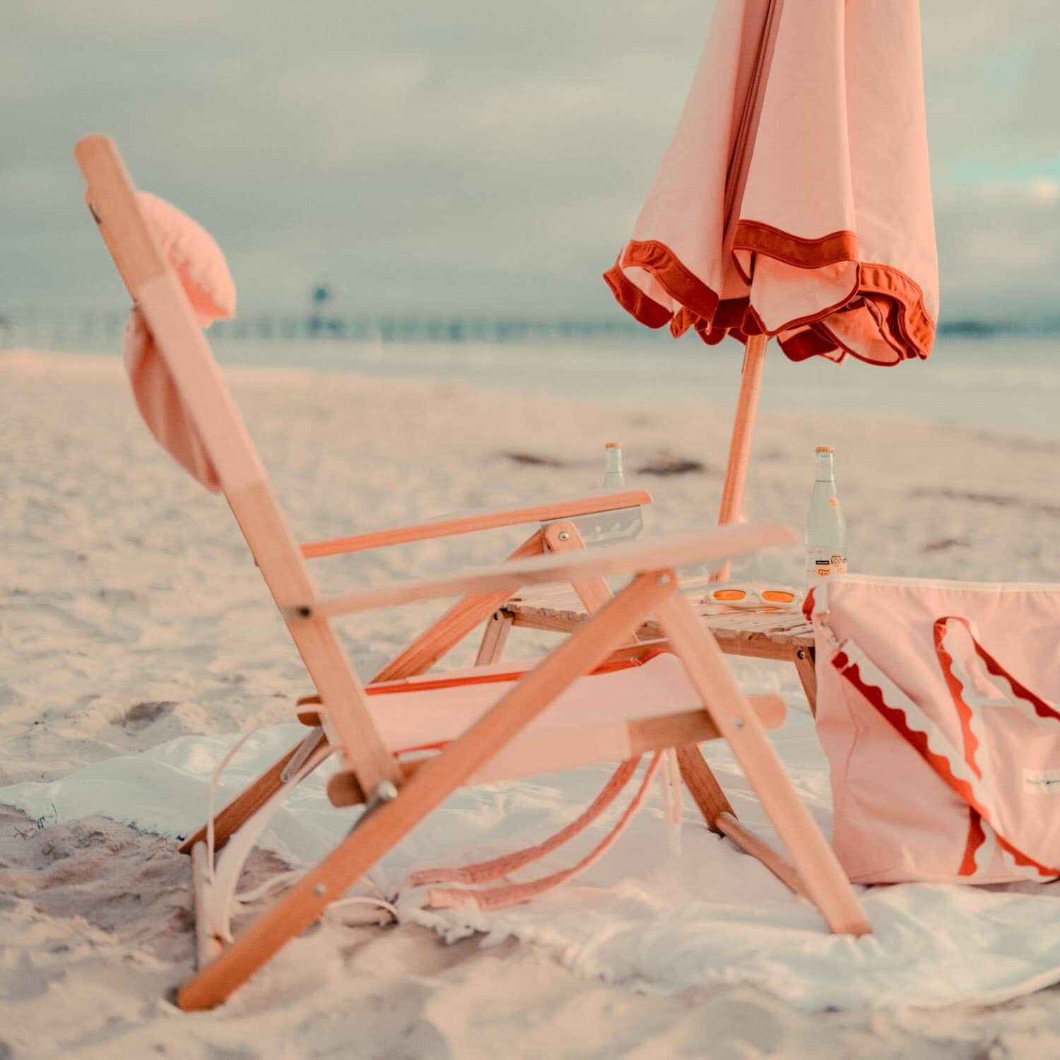 Rivie pink beach set up with chair, umbrella and cooler