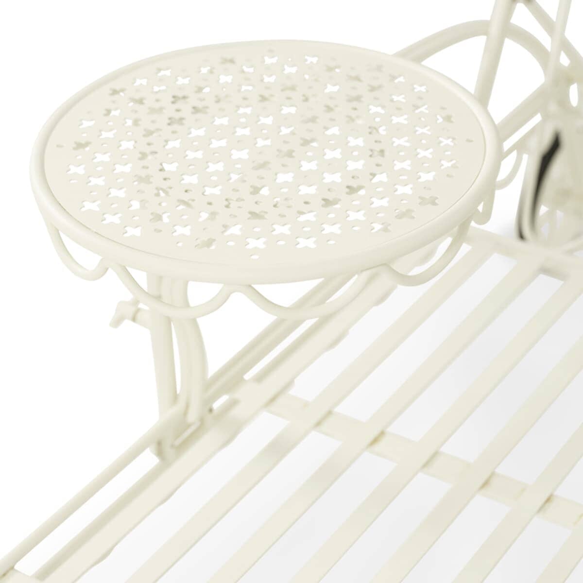 close up of side table on white metal lounger in studio