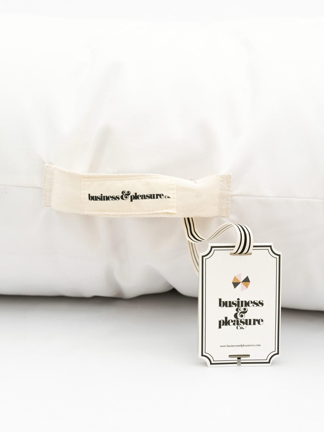image of floor pillow handle and hang tag
