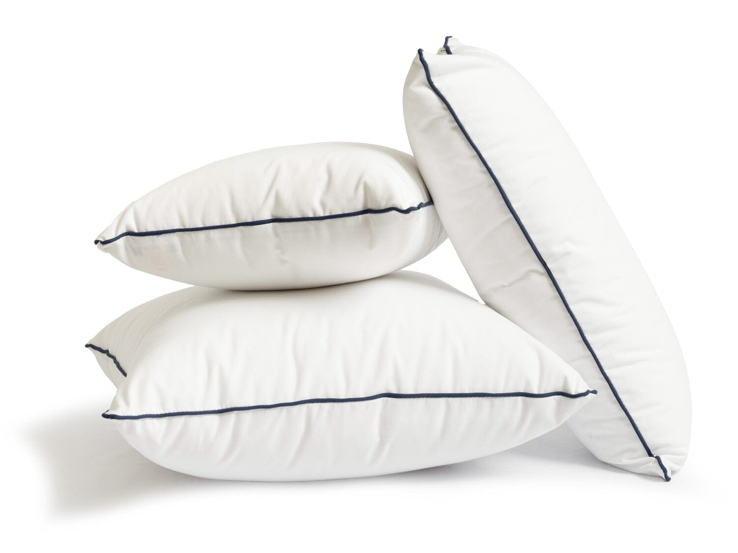 studio image of small white throw pillow