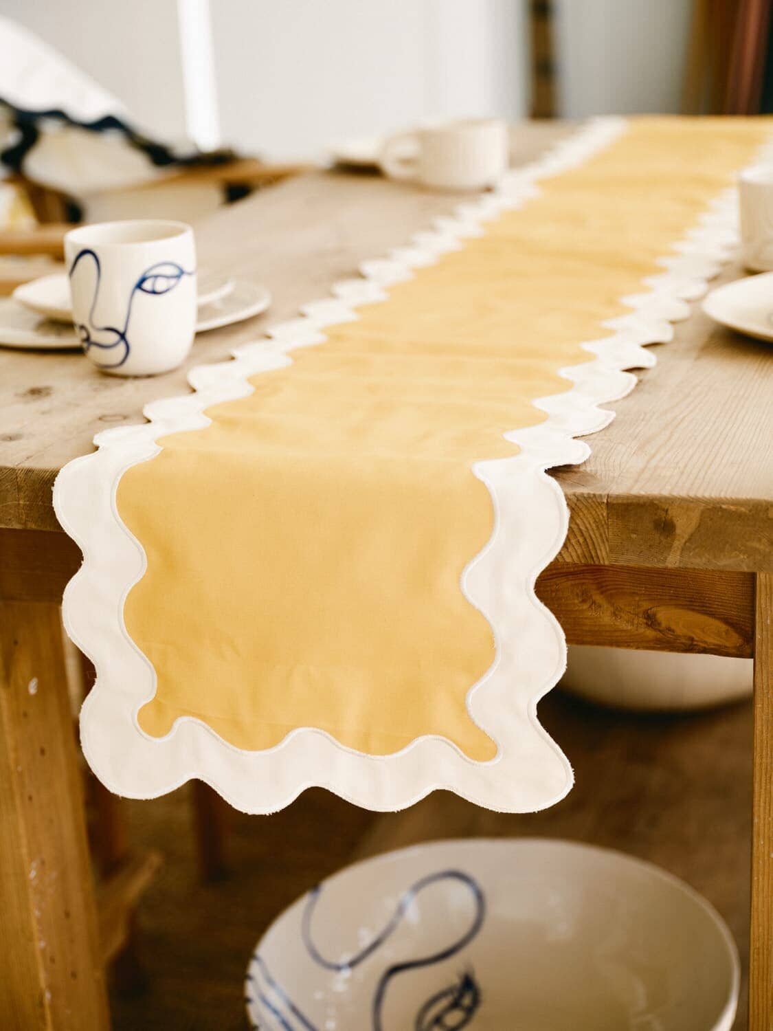 riviera mimosa table runner draped over a table