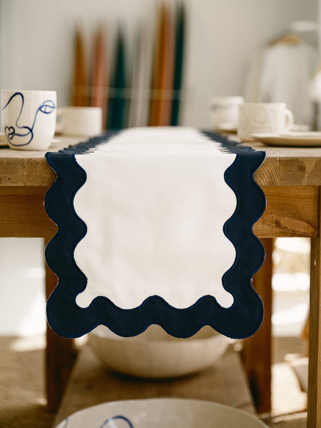 riviera white table runner draped over a table