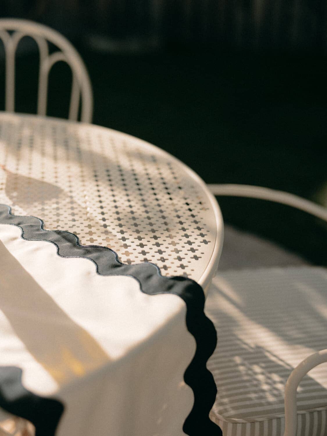 close up of top of al fresco table with table runner