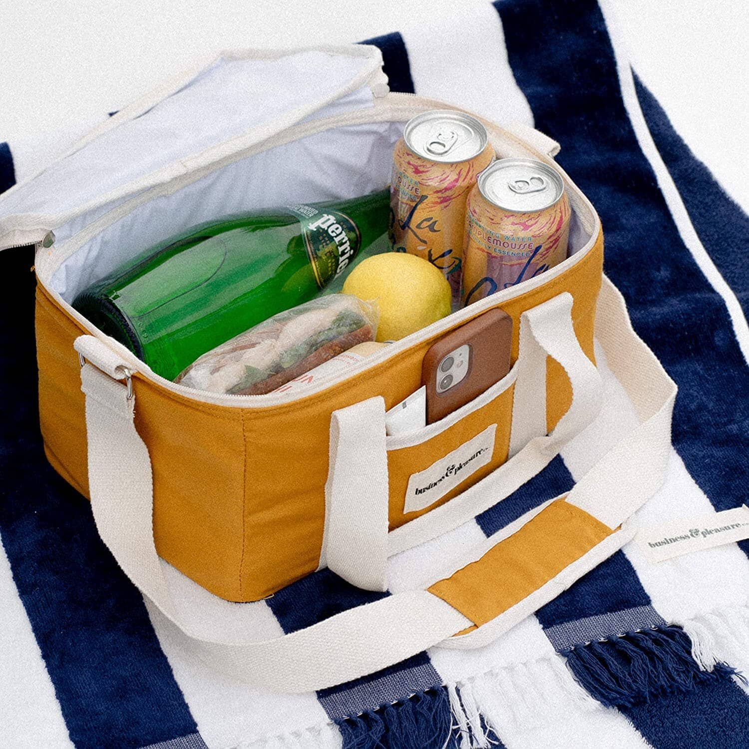 gold cooler bag filled with snacks and drinks