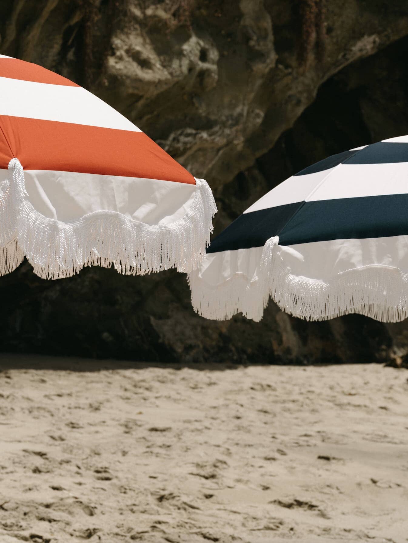 le sirenuse and navy holiday umbrellas on the beach