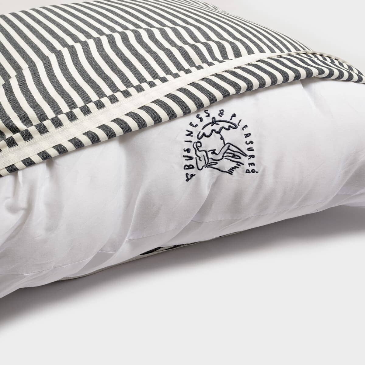 Studio image of cushion insert featuring the logo