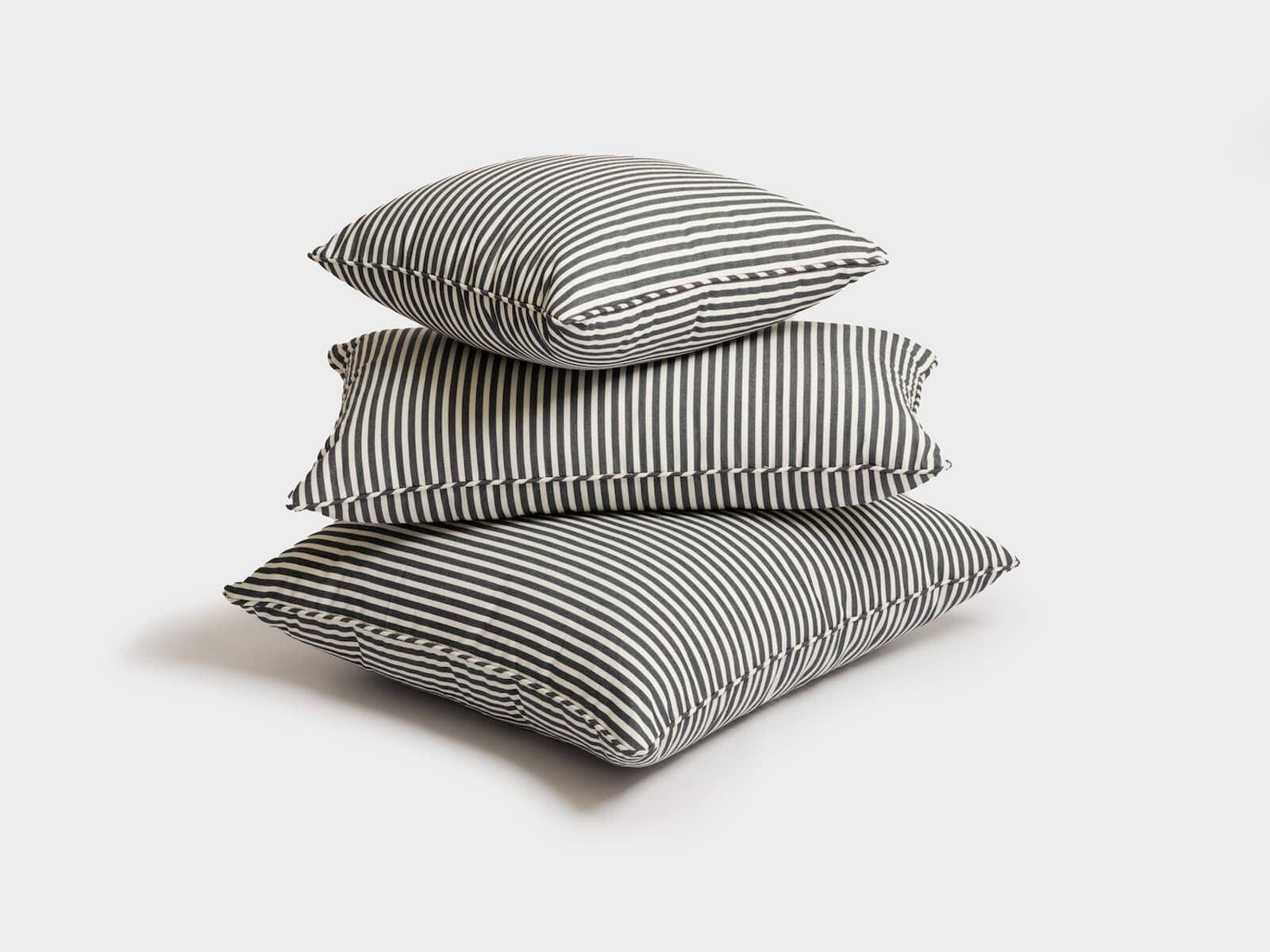 Studio image of navy stripe euro pillow, square pillow and rectangle pillow