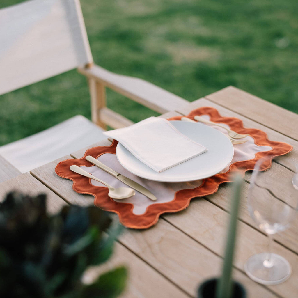riviera pink placemat on a table with plate
