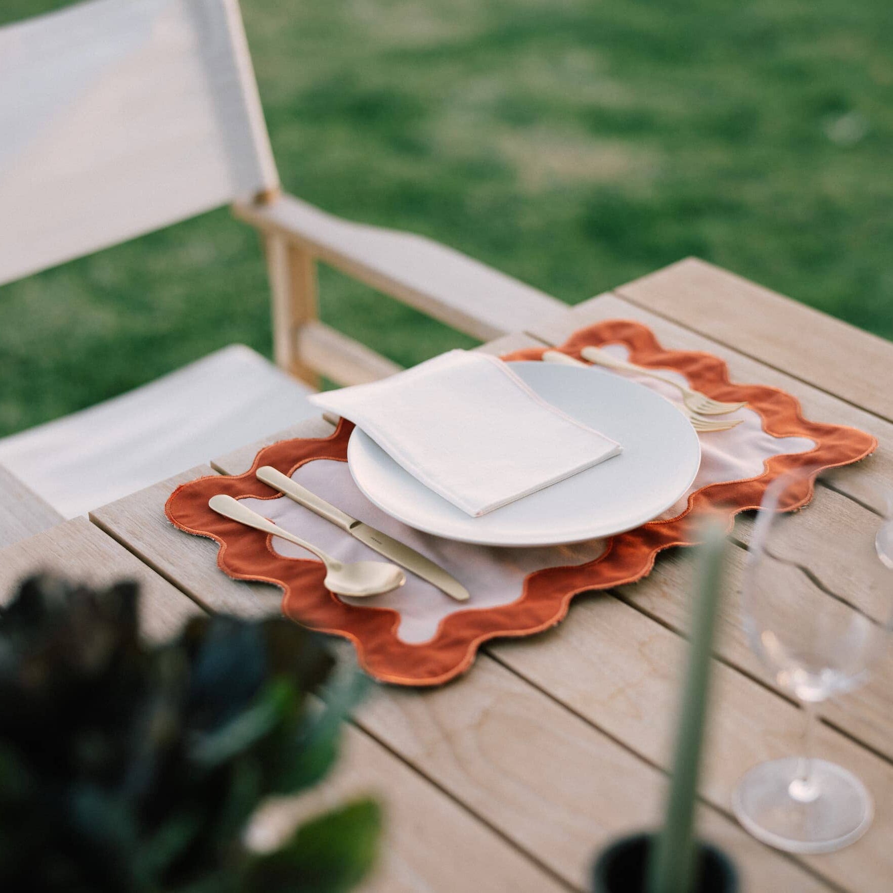 riviera pink placemat on a table with plate
