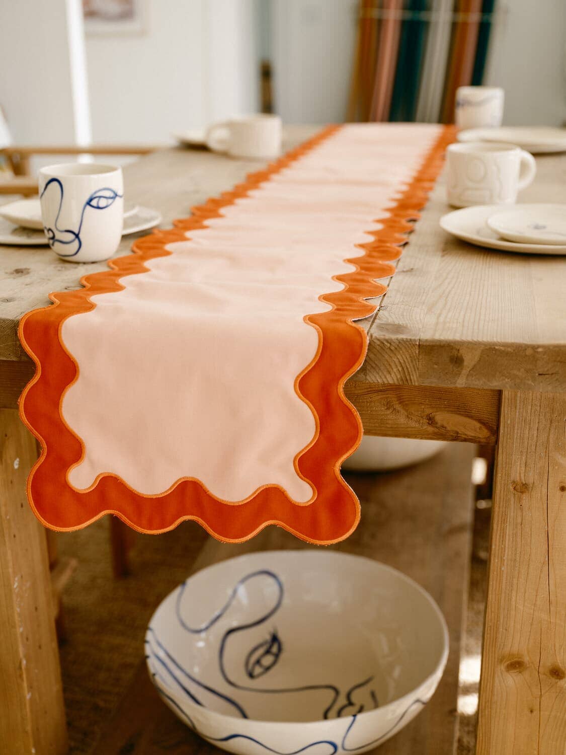 riviera pink table runner draped over a table