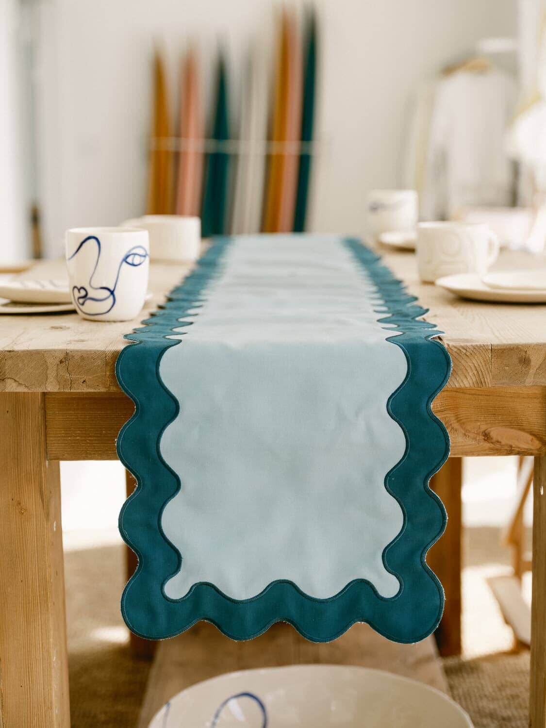 riviera green table runner hanging off edge of table