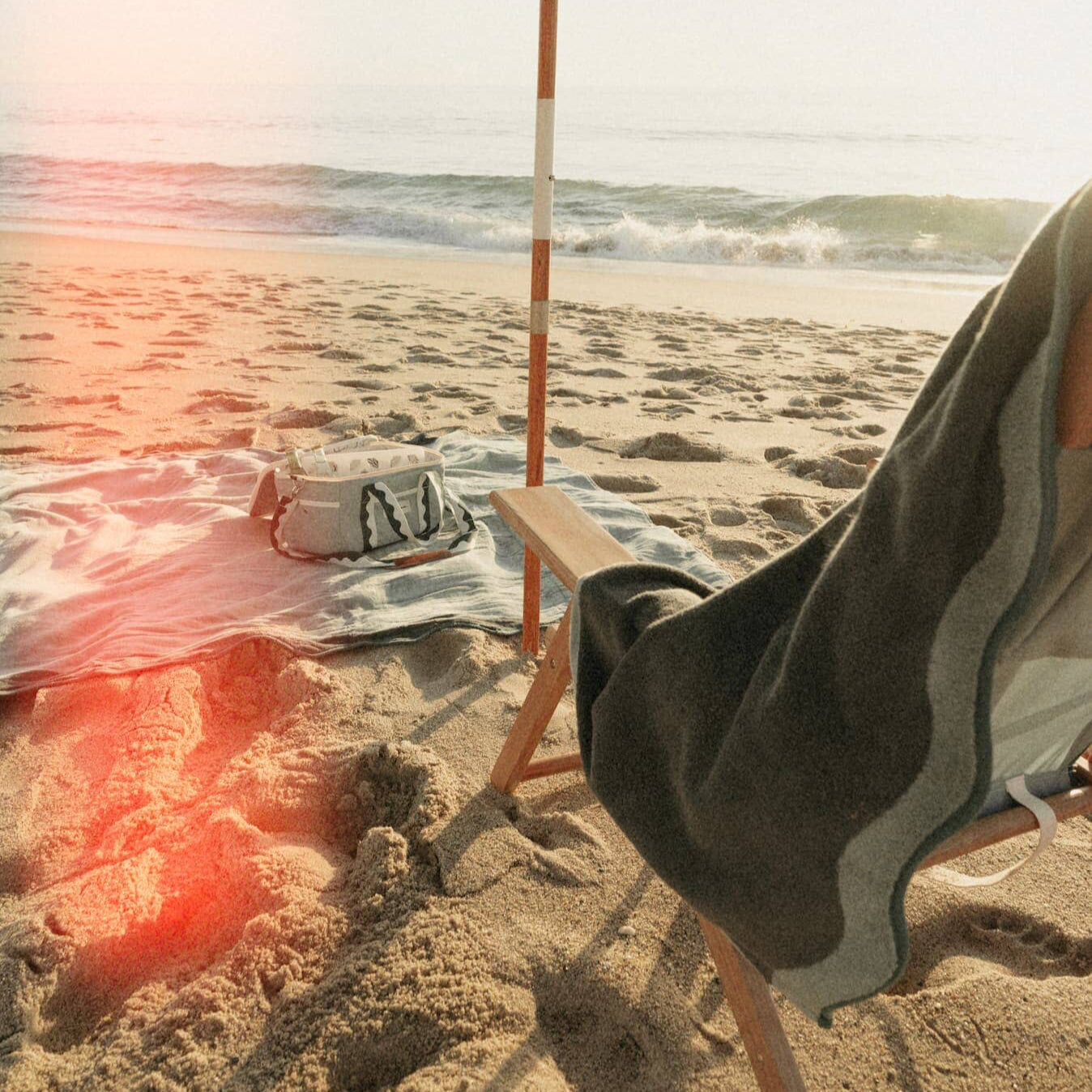 Beach set up with Riviera green umbrella, chair, towel & cooler