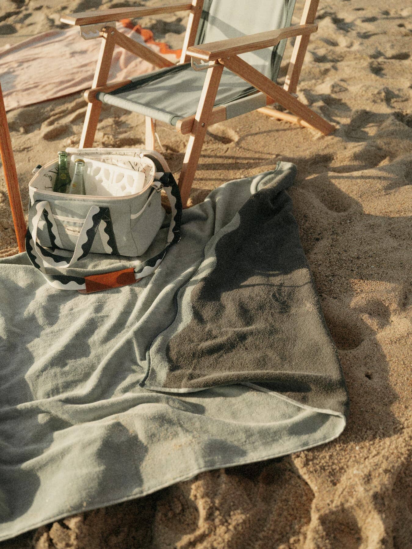 Beach set up with Riviera green umbrella, chair, towel & cooler