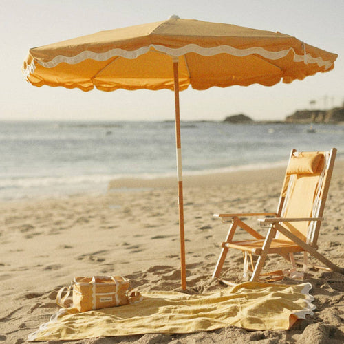 Beach setting with Riviera mimosa umbrella, chair, towel & cooler