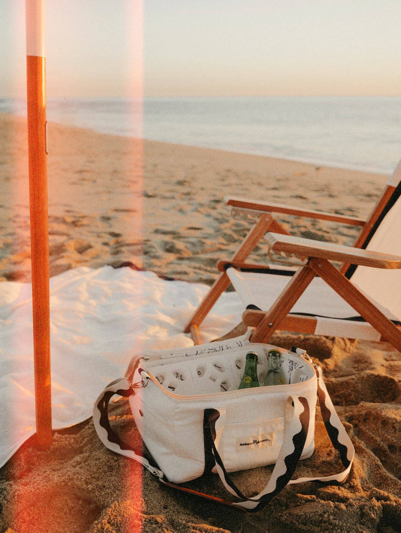 Close up of riviera white cooler and chair on the beach