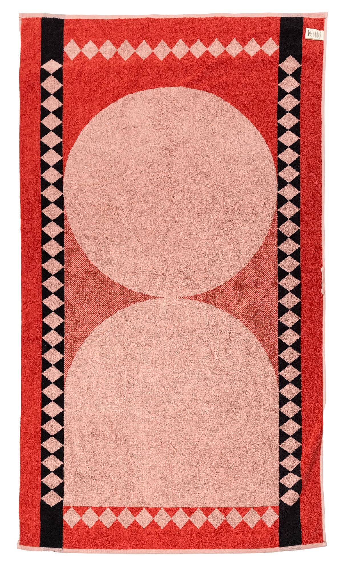 Studio image of back of diamond pink beach towel