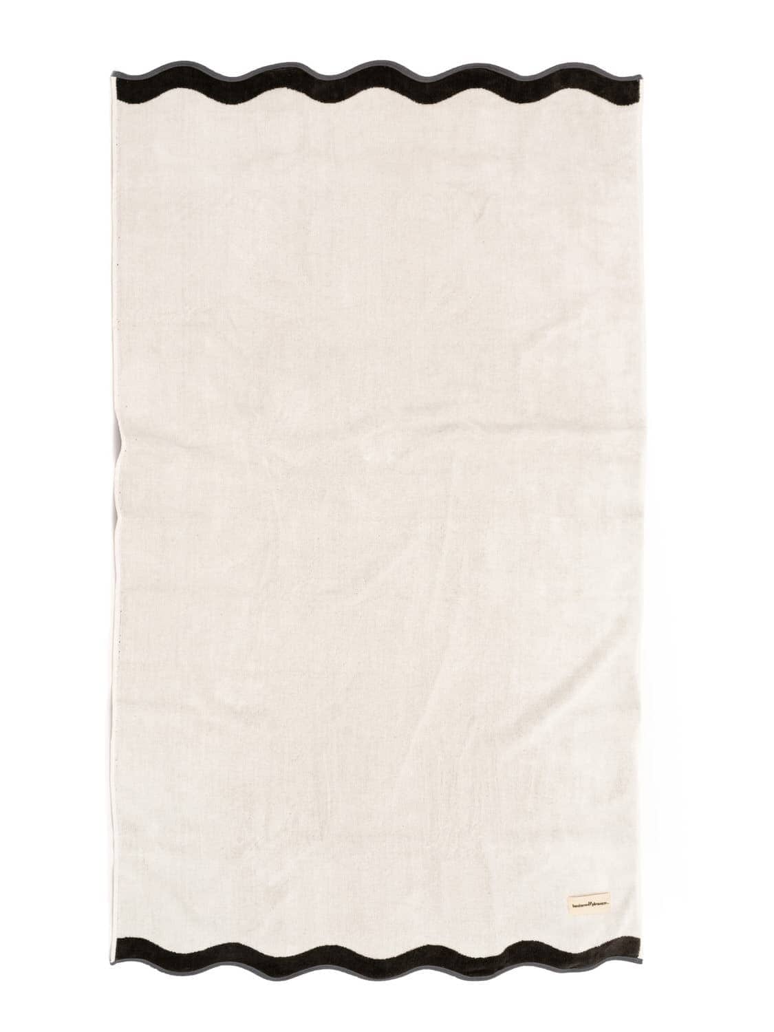 studio image of white riviera beach towel